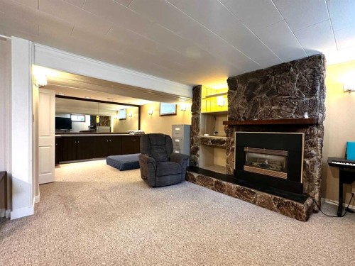 1806 13 Avenue South, Lethbridge, AB - Indoor Photo Showing Living Room With Fireplace