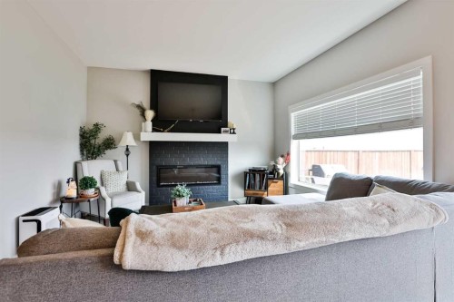 962 Miners Boulevard West, Lethbridge, AB - Indoor Photo Showing Bedroom With Fireplace
