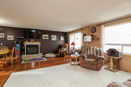 210 Macewan Street, Granum, AB - Indoor Photo Showing Living Room With Fireplace