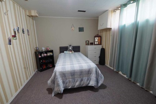 4627 50 Avenue, Taber, AB - Indoor Photo Showing Bedroom