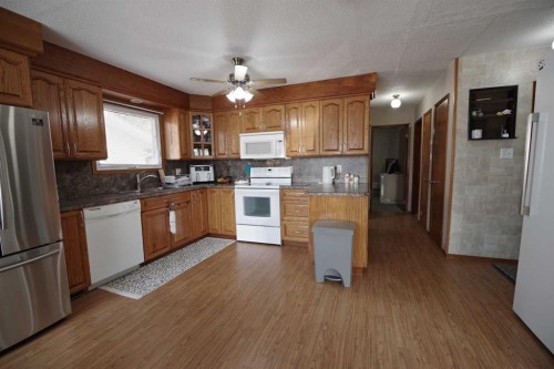 4627 50 Avenue, Taber, AB - Indoor Photo Showing Kitchen With Double Sink