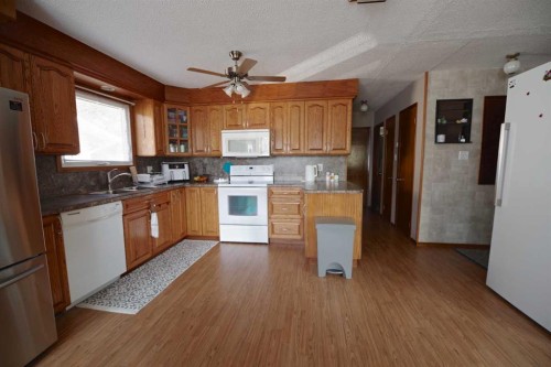 4627 50 Avenue, Taber, AB - Indoor Photo Showing Kitchen With Double Sink