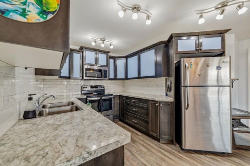 5-103 Crocus Terrace West, Lethbridge, AB - Indoor Photo Showing Kitchen With Stainless Steel Kitchen With Double Sink With Upgraded Kitchen