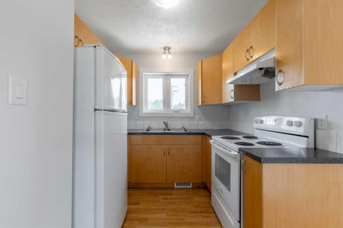 5105 2 Street, Coalhurst, AB - Indoor Photo Showing Kitchen With Double Sink