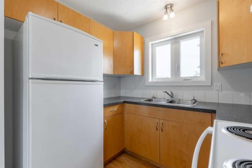5105 2 Street, Coalhurst, AB - Indoor Photo Showing Kitchen With Double Sink