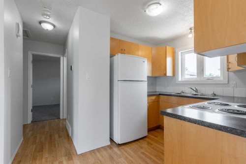5105 2 Street, Coalhurst, AB - Indoor Photo Showing Kitchen With Double Sink