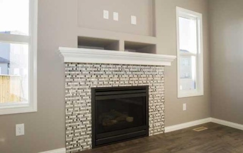 1548 Coalbanks Boulevard West, Lethbridge, AB - Indoor Photo Showing Living Room With Fireplace