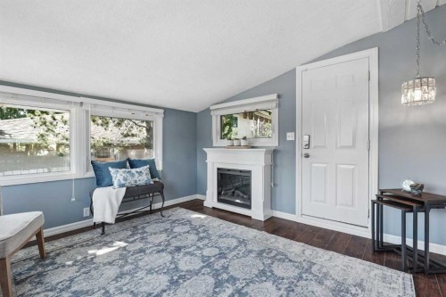 210 Dunkirk Street South, Lethbridge, AB - Indoor Photo Showing Living Room With Fireplace