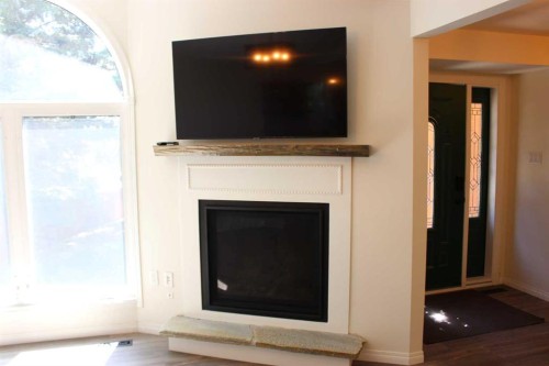 518 Maple Crescent, Picture Butte, AB - Indoor Photo Showing Living Room With Fireplace
