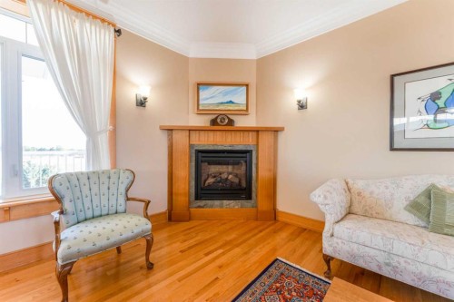 416 7 Avenue Ne, Milk River, AB - Indoor Photo Showing Living Room With Fireplace