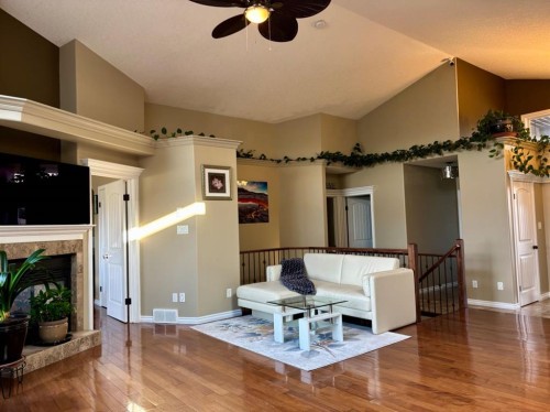 314 Coulee Springs Terrace South, Lethbridge, AB - Indoor Photo Showing Living Room With Fireplace