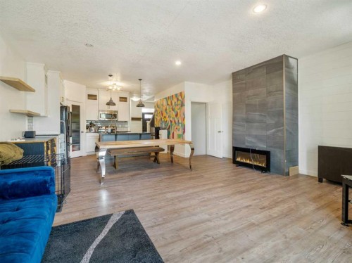 2244 18 Avenue, Coaldale, AB - Indoor Photo Showing Living Room With Fireplace