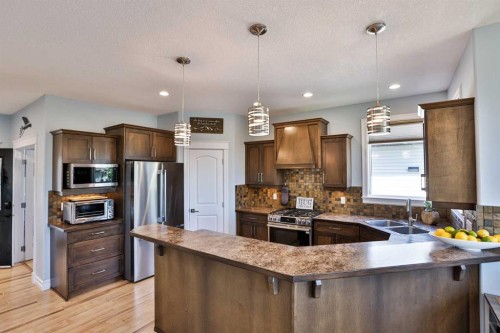 19 Canyoncrest Court West, Lethbridge, AB - Indoor Photo Showing Kitchen With Stainless Steel Kitchen With Double Sink With Upgraded Kitchen