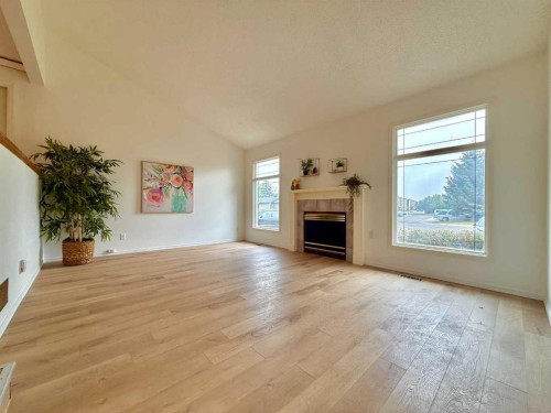 47 Princeton Crescent, Lethbridge, AB - Indoor Photo Showing Living Room With Fireplace