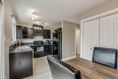 2-237 Silkstone Road West, Lethbridge, AB - Indoor Photo Showing Kitchen With Double Sink