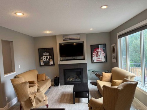 917 Canyonview Place West, Lethbridge, AB - Indoor Photo Showing Living Room With Fireplace