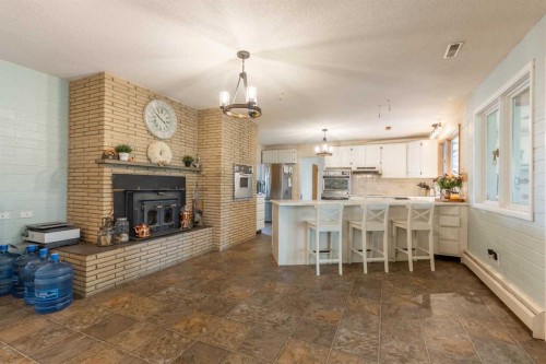 54032 Rr 20-2, Raymond, AB - Indoor With Fireplace