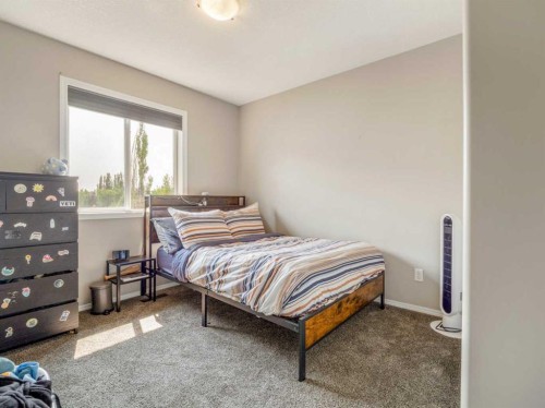 95 Heritage Point West, Lethbridge, AB - Indoor Photo Showing Bedroom