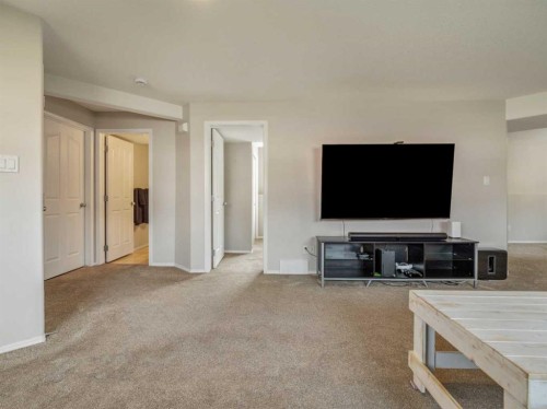 95 Heritage Point West, Lethbridge, AB - Indoor Photo Showing Living Room
