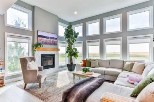 1222 Pacific Circle West, Lethbridge, AB - Indoor Photo Showing Living Room With Fireplace