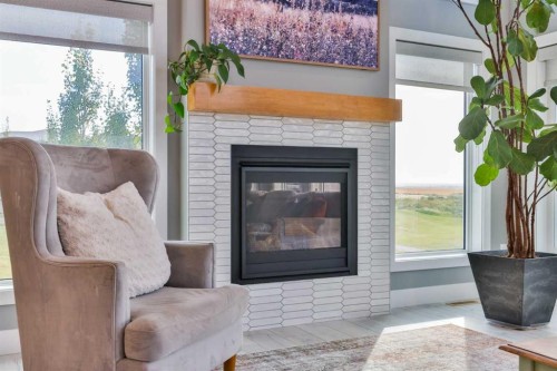 1222 Pacific Circle West, Lethbridge, AB - Indoor Photo Showing Living Room With Fireplace