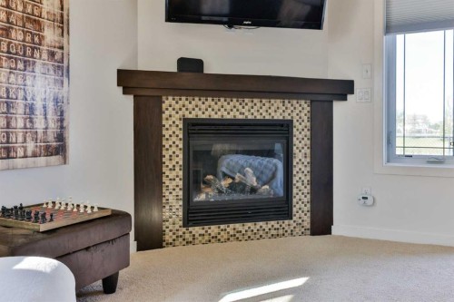 154 Lasalle Terrace West, Lethbridge, AB - Indoor Photo Showing Living Room With Fireplace