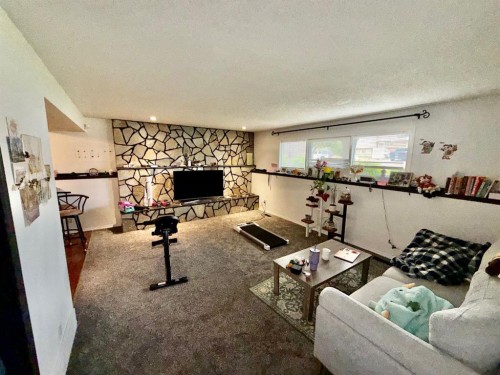1914 17 Street North, Lethbridge, AB - Indoor Photo Showing Living Room With Fireplace