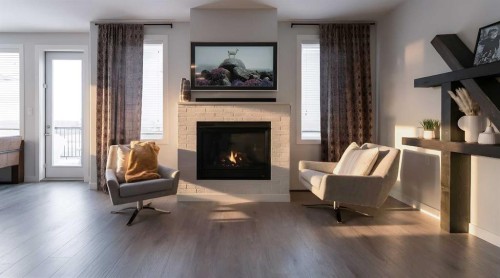 781 Atlantic Cove West, Lethbridge, AB - Indoor Photo Showing Living Room With Fireplace