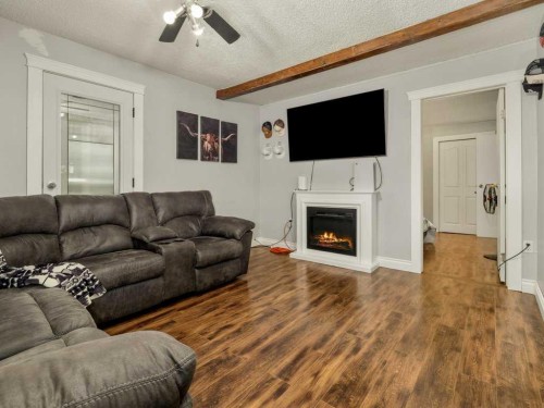 1503 20 Street, Coaldale, AB - Indoor Photo Showing Living Room With Fireplace