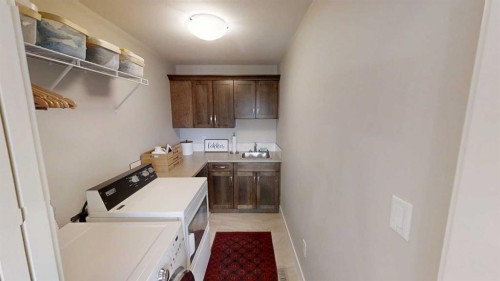320 Stonecrest Place West, Lethbridge, AB - Indoor Photo Showing Laundry Room