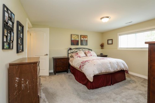14 Centennial Place, Magrath, AB - Indoor Photo Showing Bedroom