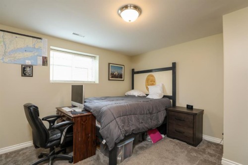 14 Centennial Place, Magrath, AB - Indoor Photo Showing Bedroom