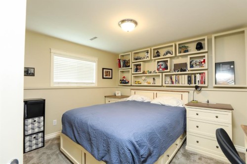 14 Centennial Place, Magrath, AB - Indoor Photo Showing Bedroom