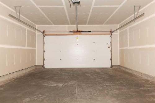 320 Aquitania Boulevard West, Lethbridge, AB - Indoor Photo Showing Garage
