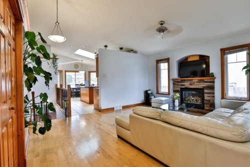 128 Cougar Road North, Lethbridge, AB - Indoor Photo Showing Living Room With Fireplace