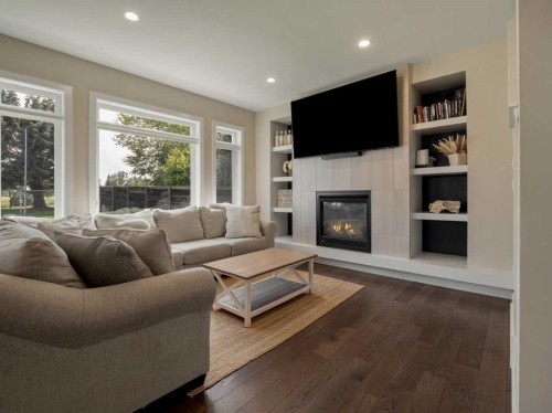187 Westgate Drive, Coaldale, AB - Indoor Photo Showing Living Room With Fireplace
