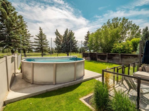 187 Westgate Drive, Coaldale, AB - Outdoor With Above Ground Pool With Backyard