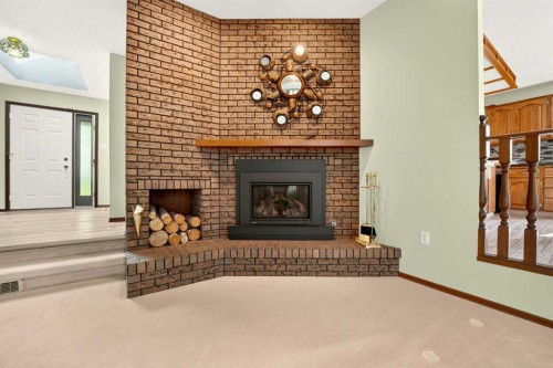 3606 Spruce Drive South, Lethbridge, AB - Indoor Photo Showing Living Room With Fireplace