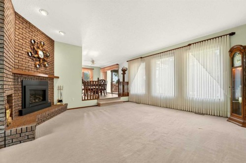3606 Spruce Drive South, Lethbridge, AB - Indoor Photo Showing Living Room With Fireplace