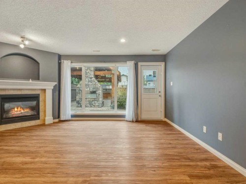 34 Heritage Green West, Lethbridge, AB - Indoor Photo Showing Living Room With Fireplace