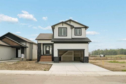 57 Malloy Terrace, Coaldale, AB - Outdoor With Facade