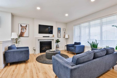 556 Riverhills Way West, Lethbridge, AB - Indoor Photo Showing Living Room With Fireplace