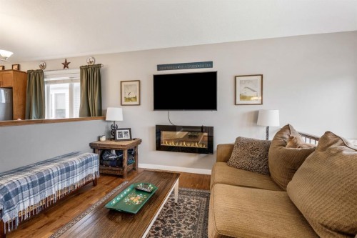 135 Fairmont Point South, Lethbridge, AB - Indoor Photo Showing Living Room With Fireplace