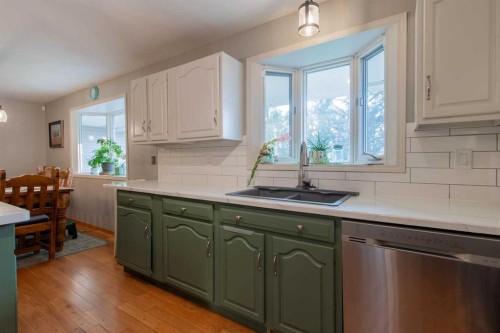 63009 Rr 210, Raymond, AB - Indoor Photo Showing Kitchen With Double Sink
