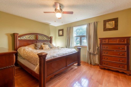 63009 Rr 210, Raymond, AB - Indoor Photo Showing Bedroom