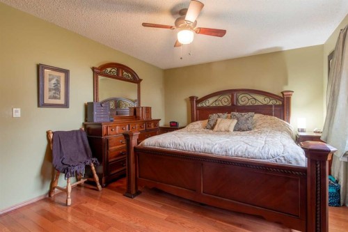 63009 Rr 210, Raymond, AB - Indoor Photo Showing Bedroom