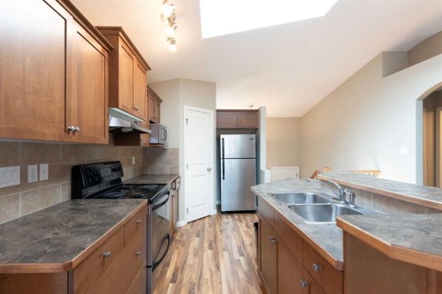 27 Fairmont Road South, Lethbridge, AB - Indoor Photo Showing Kitchen With Double Sink