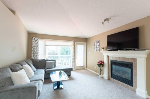 27 Fairmont Road South, Lethbridge, AB - Indoor Photo Showing Living Room With Fireplace