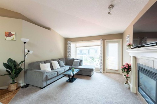 27 Fairmont Road South, Lethbridge, AB - Indoor Photo Showing Living Room With Fireplace