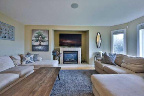 135 Riverbrook Close West, Lethbridge, AB - Indoor Photo Showing Living Room With Fireplace